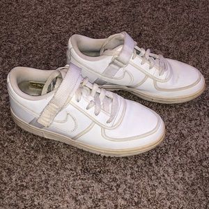 White Nike sneakers with strap